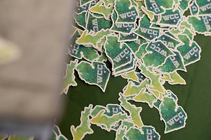 wcc stickers on a table at a past welcome day